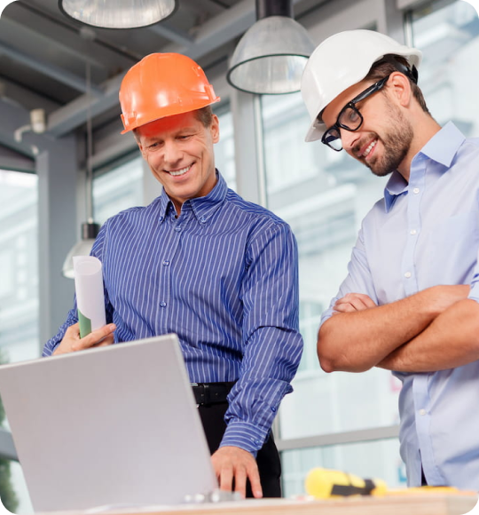 General Contractors hero image of Two engineers looking at notebook