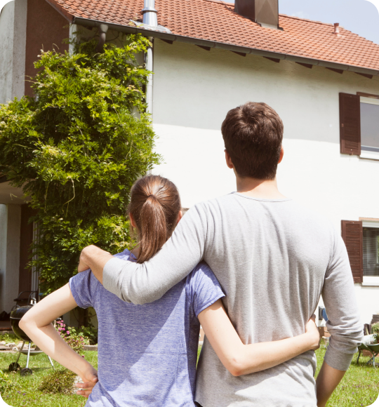 Owners hero image of a couple looking at house